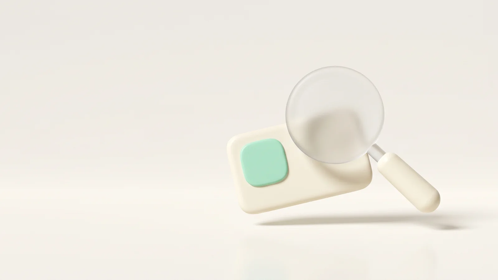 A frosted-glass magnifying glass inspecting a small cream contact card, representing verifying a creator email address before outreach.